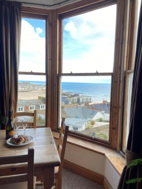 THE STONES a beautifully presented PRIVATE APARTMENT with far reaching VIEWS Over ST IVES HARBOUR and BAY and FREE ONSITE PARKING for LARGER GROUPS book along with our Connecting TWO SISTER APARTMENTS